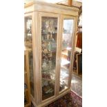 Tall two-door display cabinet in limed beech finish