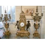 Continental ormolu, bronze and marble clock garniture set by Imperial, the clock being flanked by