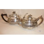 Sterling silver teapot with foliate repoussé decoration (lid hinge broken). Hallmarked for London