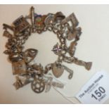 Vintage Sterling silver charm bracelet with plenty of charms, some opening and including an enamel