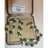 Freshwater pearl and malachite bead necklace with 9ct gold clasp in antique case