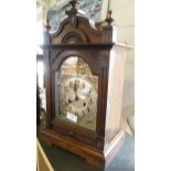 Victorian oak cased mantle clock with arched dial