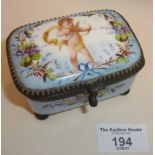 Continental porcelain trinket box decorated with a hand-painted cupid to lid