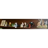 Shelf of assorted Dolphin ornaments and others