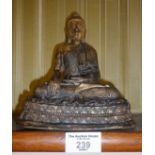 Oriental brass-shim covered buddha