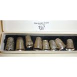 8 silver thimbles