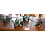 Four diecast field guns and a howitzer