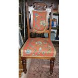 Pair of Edwardian carved oak dining chairs with tapestry style upholstery