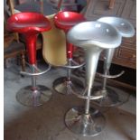 Four fibreglass and chrome kitchen bar stools