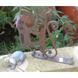Wrought iron folk art wall bracket with horse cut out panel and a rabbit
