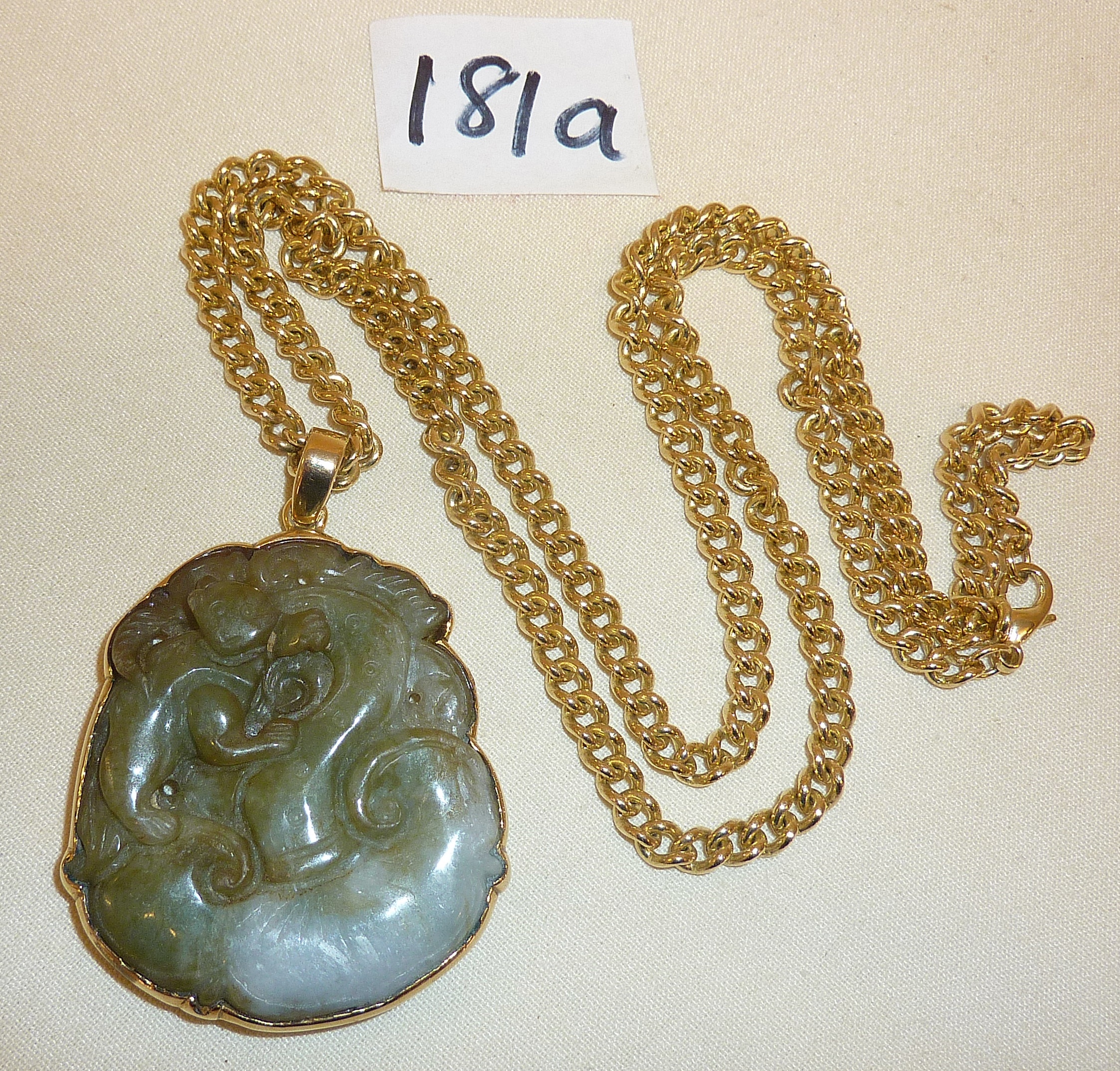 Chinese double-sided carved jade pendant in the form of a monkey on Lingzhi fungus with 9ct gold