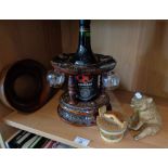 Carved and varnished wood sherry dispenser with glasses, a bear and two other items