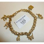 9ct gold heavy charm bracelet and charms - some opening. Approx. 43g in weight
