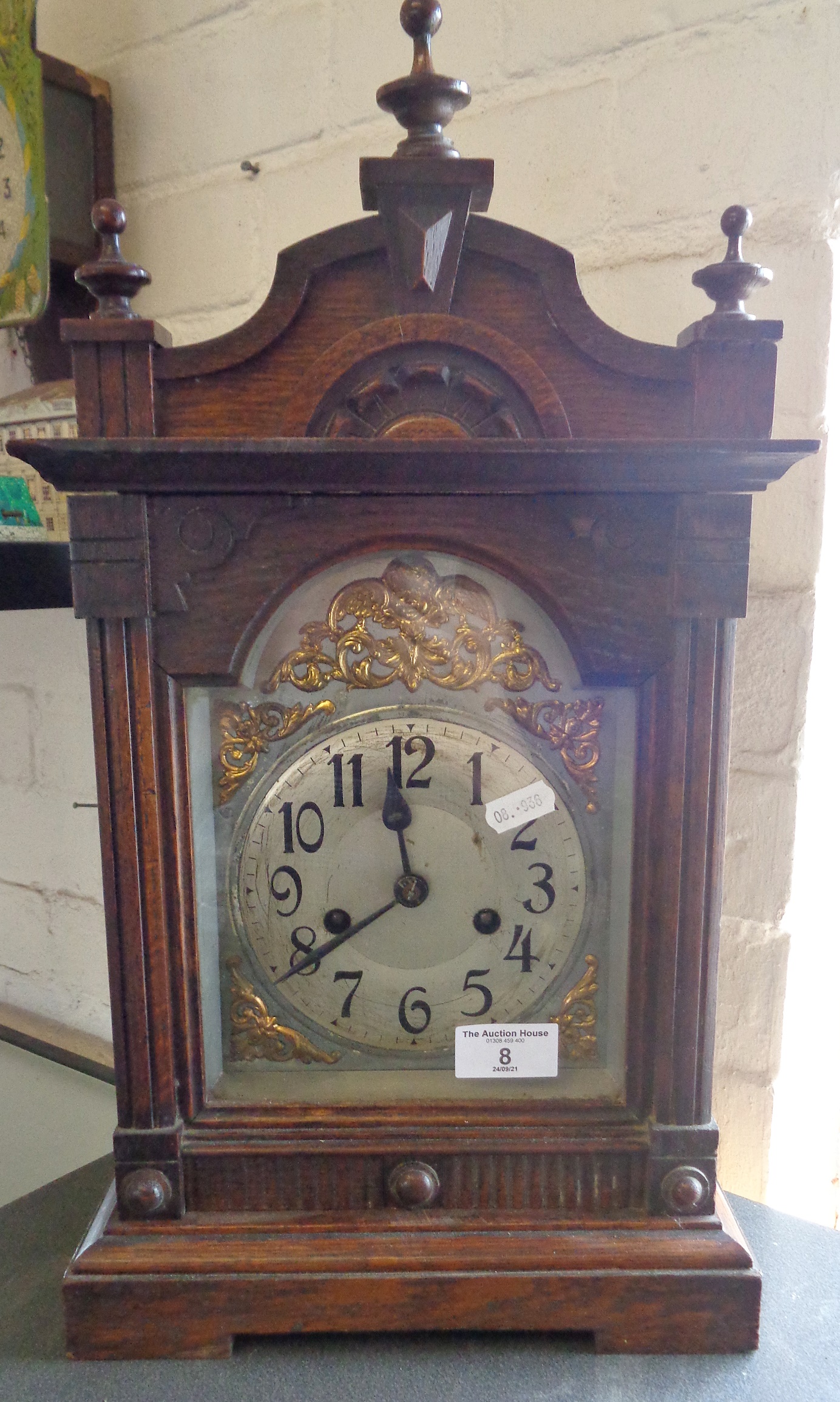 Victorian oak cased mantle clock with arched dial