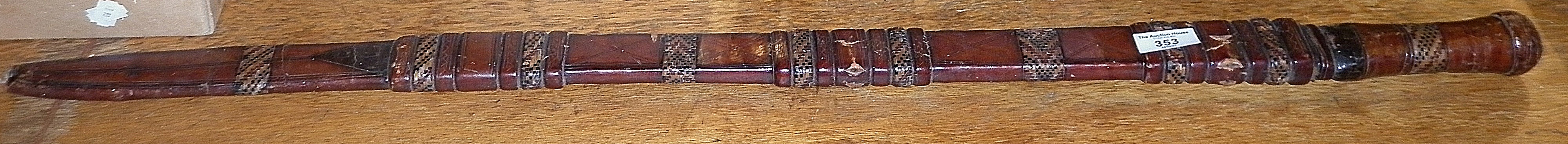 Tribal Art: North African sword with European sabre blade and leather covered hilt and sheath