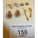 Two pairs of 18ct and two pairs of 9ct gold earrings