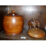 Kitchen treen, a turned fruitwood biscuit barrel, another wooden pot and a carved elephant