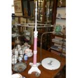 Victorian pillar shop scales with ceramic and iron centre column, brass pan weights and transfer