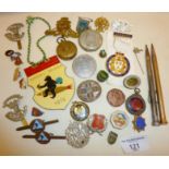 Assorted badges, some mounted silver coins, military cap badges, Eversharp pencils, etc.