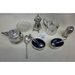 Two silver pepper pots, mustard and salt spoons and silver-plated cruets