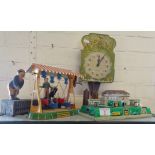 Vintage tin plate clockwork fairground boat ride, a similar tinplate revolving coaches in tunnel