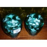 Pair Nailsea green glass dumps having flowers in vase design