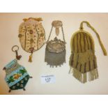 Four antique ladies purses or evening bags, a Georgian silk embroidered example with gilt closure,
