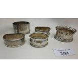 Five various silver serviette rings