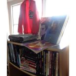Large collection of books on Elvis Presley (47) and a red Elvis in Concert jacket