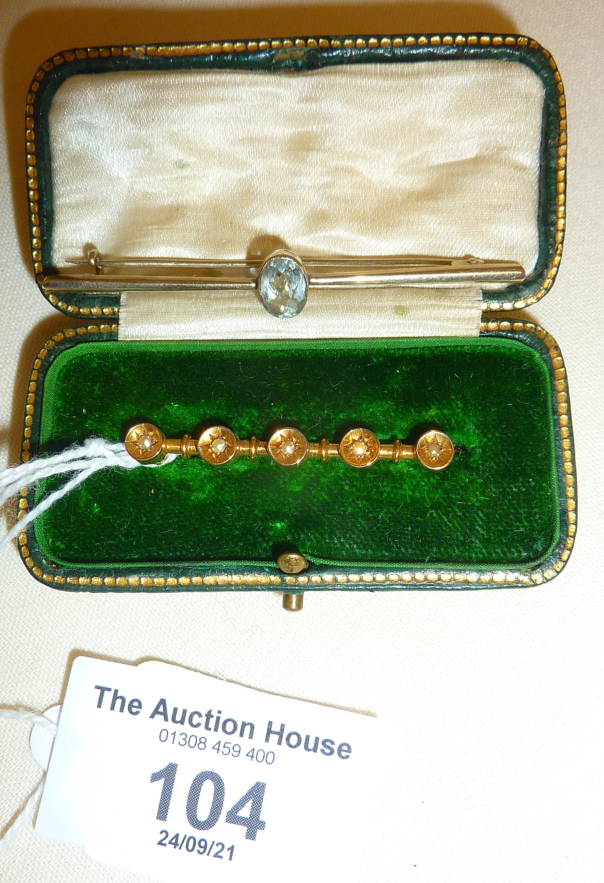 9ct gold and seed pearl bar brooch in case, with another 9ct white gold set with faceted clear