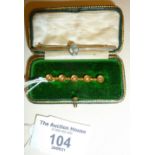 9ct gold and seed pearl bar brooch in case, with another 9ct white gold set with faceted clear