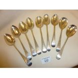 Nine old Sterling silver dessert spoons in the Old English pattern - various makers, some