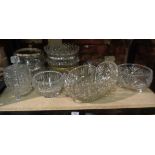 9 cut glass fruit bowls and a moulded glass biscuit jar