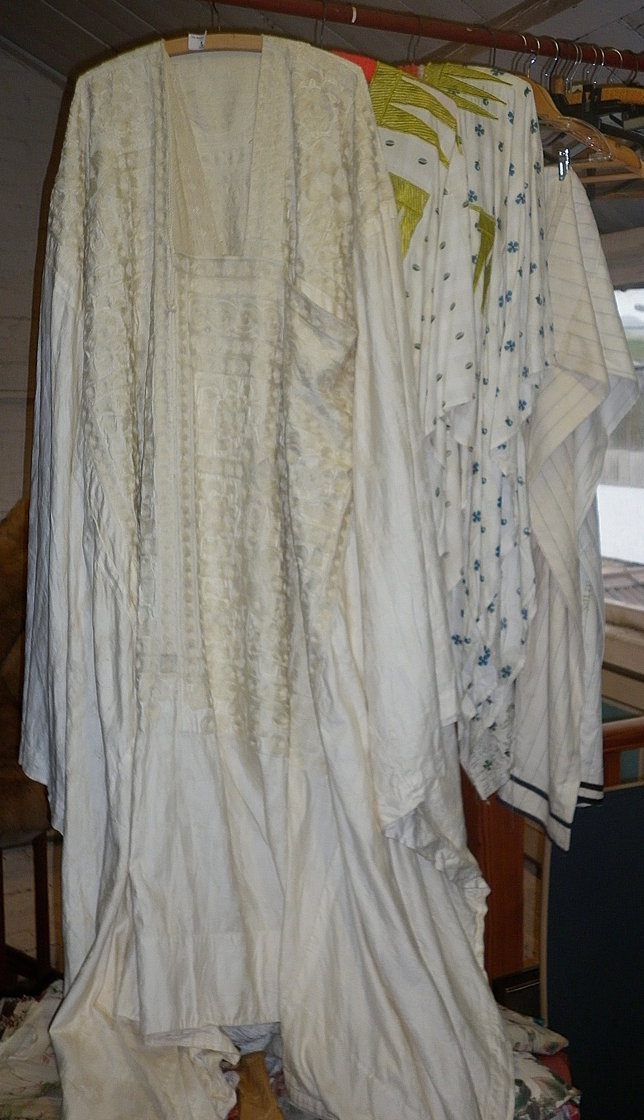 Vintage clothing: a Nigerian ceremonial cotton gown with crewel-work decoration and similar trousers