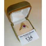 18ct gold ring with central ruby surrounded by diamonds, approx UK size S and weight 3.5g