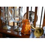 Pair of glass hurricane candle holders on silver-plated bases, metal wall light sconce with