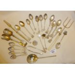 Silver plate and white metal spoons and other cutlery, including one larger spoon with twisted