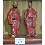 Pair of 19th c. Chinese red glazed figures of old men, 18cm tall