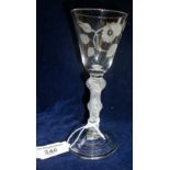 Jacobite engraved wine glass with Tudor Rose and leaves on round funnel bowl above multi spiral
