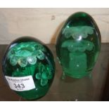 Two green "Nailsea" glass dump/paperweights with floral insets