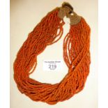 Multi strand coral necklace with Indian coin clasp