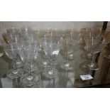 Collection of Edwardian etched wine glasses including 11 champagne coups