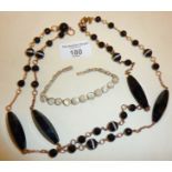 Long hallmarked Art Deco style silver and black glass necklace together with a moonstone and white