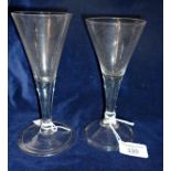 Two 18th c. trumpet wine glasses, one with air tear and folded foot
