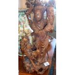 Chinese carved hardwood figure of a woman with a deer, 39cm