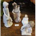 A Nao girl with double bass figure, a boy reading with puppy figure and a Zraphin girl figurine