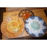 Two decorative platters and a stained glass hanging