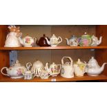 Collection of assorted china tea pots (2 shelves)