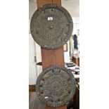 Pair of old Tibetan embossed brass mounted round plaques with turquoise and red stones insets