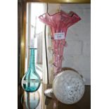 Victorian cranberry glass epergne vase, a glass ball and a small pale blue glass bottle vase